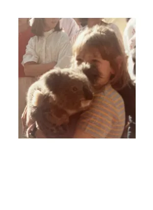Founder as a child holding a koala